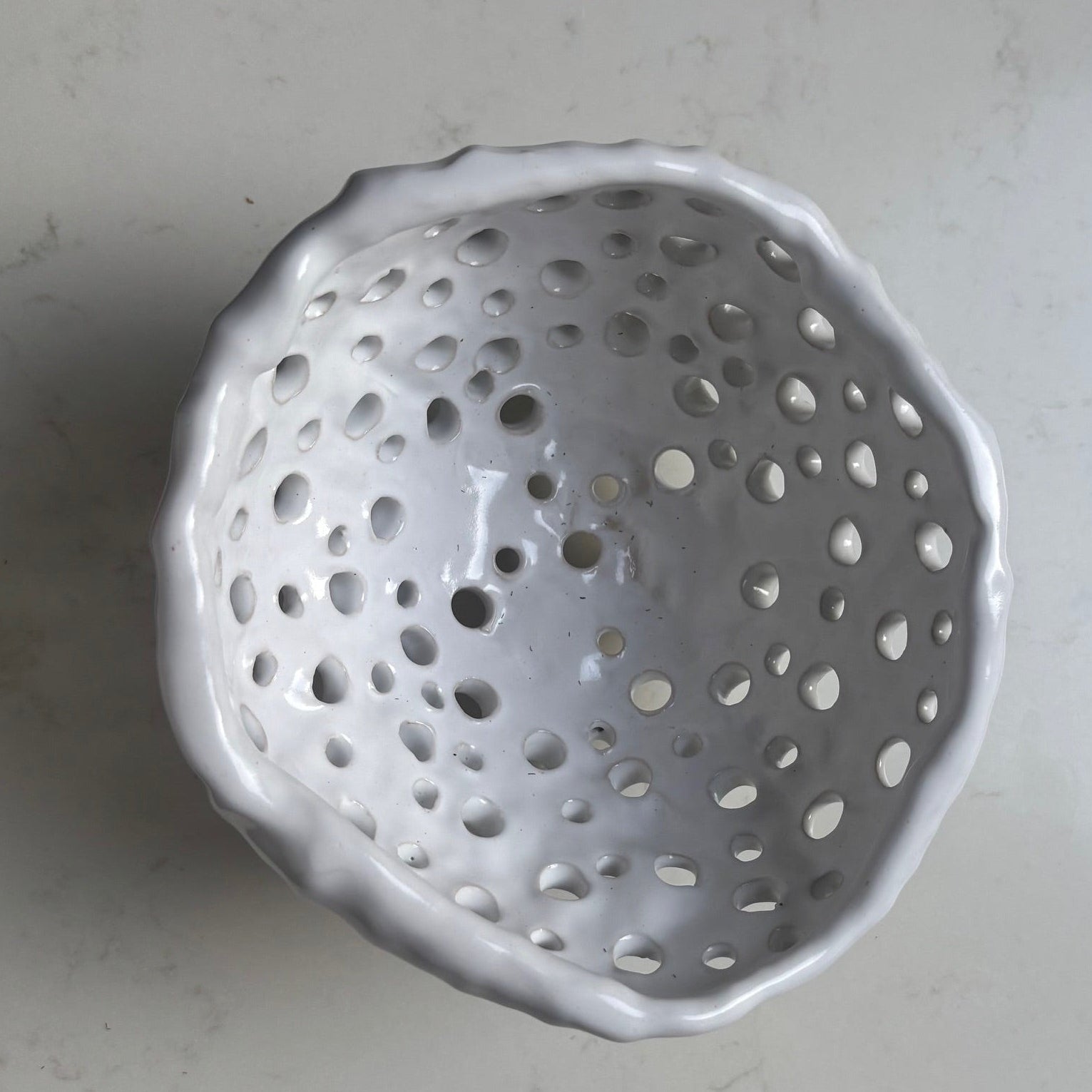 A. Mills Clay Colanders